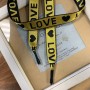 Шнурок желтого цвета из репсовой жаккардовые ленты с текстом LOVE